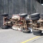 The semi truck was hauling two trailers. One flipped over and spilled human waste on the off-ramp between southbound I-5 and Highway 2. (Washington State Patrol)