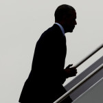 President Barack Obama is silhouetted as he walks up the stair while boarding Air Force One, Thursday, June 16, 2016, at Andrews Air Force Base, Md. Obama will visit Orlando, Fla. to pay respects to the victims of the Pulse nightclub shooting and meet with families of victims of the attack. (AP Photo/Pablo Martinez Monsivais)