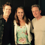 Kevin and Michael Bacon pose with KIRO Radio producer Nicole Thompson. (KIRO Radio)
