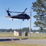 A UH-60 delivers supplies for guardsmen in Shelton ahead of Cascadia RIsing. (Washington National Guard) 