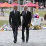 
              President Barack Obama walks with Vice President Joe Biden during their visit to a makeshift memorial at the Dr. Phillips Center for the Performing Arts, Thursday, June 16, 2016, in Orland, Fla., honoring those killed in the Pulse nightclub shooting   (Joe Burbank/Orlando Sentinel via AP) MAGS OUT; NO SALES; MANDATORY CREDIT
            