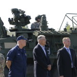 
              Major General Bret Daugherty, commander of the Washington National Guard, far left, and Washington Gov. Jay Inslee, third from left, stand in front of a Stryker vehicle, Tuesday, June 7, 2016, at Camp Murray, Wash. Daugherty and Inslee were part of the kickoff of a four-day regional earthquake and tsunami readiness drill called Cascadia Rising. (AP Photo/Rachel La Corte)
            