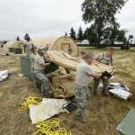 
              In this photo taken May 24, 2016, Washington Air National Guard soldiers from Fairchild Air Force Base in Spokane, Wash., work to assemble temporary living structures at Joint Base Lewis-McChord in Washington. During the second week of June emergency responders in the Pacific Northwest will conduct drills to test how ready they are to respond to a massive earthquake and tsunami. The June 7-10 exercise is called Cascadia Rising. It is named after the Cascadia Subduction Zone _ a 600-mile-long fault just off the coast that runs from Northern California to British Columbia.  (AP Photo/Ted S. Warren)
            