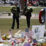 
              President Barack Obama and Vice President Joe Biden arrive to place flowers at a memorial in Orlando, Fla., Thursday, June 16, 2016, in honor of people killed in the shooting at a gay nightclub. (AP Photo/Pablo Martinez Monsivais)
            