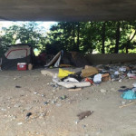 A homeless camp is set up along I-5 near 45th Ave. and the Ship Canal Bridge. (O'Neill)