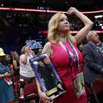 
              Dana Dougherty from Deltona, Fla., cheers as she holds a Donal Trump figure during first day of the Republican National Convention in Cleveland, Monday, July 18, 2016. (AP Photo/Carolyn Kaster)
            