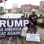 
              Elan Stoltzfuz stands during a rally for Republican presidential candidate Donald Trump at Settlers Landing Park on Monday, July 18, 2016, in Cleveland.  (AP Photo/John Minchillo)
            