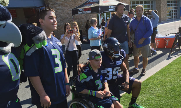 Seahawks WR Doug Baldwin visits with Jesse Bailey (l) and Steven Snider during their Make-A-Wish vi...