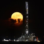 A full moon rises behind a drilling rig Monday, Nov. 14, 2016, seen in Odessa, Texas. The brightest moon in almost 69 years is lighting up the sky in a treat for star watchers around the globe. The phenomenon known as the supermoon reached its peak luminescence in North America before dawn on Monday. Its zenith in Asia and the South Pacific was Monday night. (Mark Sterkel/Odessa American via AP)