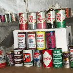 Rare and valuable cans from Olympia and Rainier, as well as cans for other local products, are well-represented in the inadvertent time capsule at the Boeing wind tunnel.  (Courtesy of Simon Metals)