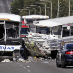 
              FILE - In this Sept. 24, 2015, file photo, a "Ride the Ducks" amphibious tour bus, right, and a charter bus remain at the scene of a fatal collision on the Aurora Bridge in Seattle. Ride the Ducks International has agreed to pay up to $1 million in civil penalties under a consent order reached with federal transportation officials. The National Highway Traffic Safety Administration said Tuesday, Dec. 6, 2016, that the Branson, Missouri, manufacturer of the duck boats violated motor vehicle safety laws when it failed to initiate a full safety recall. One of the vehicles the company manufactured and sold was the one involved in the crash on the Seattle bridge, killing five college students. (AP Photo/Elaine Thompson, File)
            