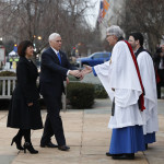 
              Rev. Luis Leon greets Vice President-elect Mike Pence and his wife Karen as they arrive for a church service at St. John’s Episcopal Church across from the White House in Washington, Friday, Jan. 20, 2017, on Donald Trump's inauguration day. (AP Photo/Alex Brandon)
            