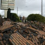 A crowed gathers to look at damage to a Hazel Dell Avenue office park after a tornado swept through the area, toppling trees and power lines, Thursday, Jan. 10, 2008 in Vancouver, Wash. (AP Photo/The Columbian, Zachary Kaufman)