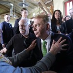 Seattle Mayor Ed Murray is surrounded and embraced by supporters after reading a statement saying that he is dropping his re-election bid for a second term Tuesday, May 9, 2017, in Seattle. Last month a man filed a lawsuit claiming he was sexually abused by Murray in the 1980s when he was a teenager. Three made similar allegations, and all were vehemently denied by Murray. Murray said for weeks after the allegations emerged that he would press on in his campaign for a second term but said he decided it was best for Seattle to end his campaign and not seek another term. He said he will serve out his term through the end of this year. (AP Photo/Elaine Thompson)