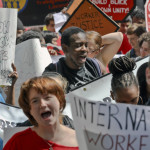 
              People participate in a May Day rally in New York, Monday, May 1, 2017. The demonstrations on May Day, celebrated as International Workers' Day, follow similar actions worldwide in which protesters from the Philippines to Paris demanded better working condition. (AP Photo/Bebeto Matthews)
            