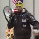 Joey Gibson with Patriot Prayer makes a speech at an anti-communist, pro-Trump rally at Westlake Park on May Day 2017. (KIRO 7)