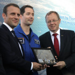 French President Emmanuel Macron, left, poses with French astronaut Thomas Pesquet and European Space Agency (ESA) Director General, Johann-Dietrich Woerner, right, while visiting the Paris Air Show in Le Bourget, north of Paris, Monday, June 19, 2017. Macron landed Monday at the Bourget airfield in an Airbus A400-M military transport plane to launch the aviation showcase, where the latest Boeing and Airbus passenger jets will vie for attention with a F-35 warplane, drones and other and high-tech hardware. (AP Photo/Michel Euler, Pool)