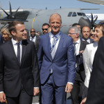 French President Emmanuel Macron, left, visits the Paris Air Show with Tom Enders, Chief Executive Officer of Airbus Group, in Le Bourget, north of Paris, Monday, June 19, 2017. Macron landed at the Bourget airfield in an Airbus A400-M military transport plane to launch the aviation showcase. (AP Photo/Michel Euler)