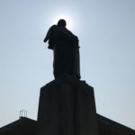 The sun puts the George Washington statue on the UW campus into deep silhouette. (Feliks Banel photo)