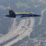 U.S. Navy Blue Angels' Lt. Tyler Davies flies over a section of Interstate 90 that was temporarily closed Thursday, Aug. 3, 2017, near Seattle, so the Angels could practice for their weekend performances in the Seafair Air Show Saturday and Sunday, Aug. 5-6, 2017. (AP Photo/Ted S. Warren)