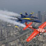 Stunt pilot Sean D. Tucker, right, flies his Team Oracle Extra 300L in formation with U.S. Navy Blue Angels' Lt. Tyler Davies, left, and Cmdr. Frank Weisser, center, Thursday, Aug. 3, 2017, above CenturyLink Field and downtown Seattle in preparation for their weekend performances in the Seafair Air Show on Saturday and Sunday, Aug. 5-6, 2017. (AP Photo/Ted S. Warren)