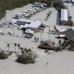 
              Floodwaters surround Gilbert's Resort in the aftermath of Hurricane Irma, Monday, Sept. 11, 2017, in Key Largo, Fla. (AP Photo/Wilfredo Lee)
            