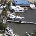 
              Boats and buildings are damaged in the aftermath of Hurricane Irma, Monday, Sept. 11, 2017, in Key Largo, Fla. (AP Photo/Wilfredo Lee)
            