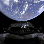 
              This image from video provided by SpaceX shows the company's spacesuit in Elon Musk's red Tesla sports car which was launched into space during the first test flight of the Falcon Heavy rocket on Tuesday, Feb. 6, 2018. (SpaceX via AP)
            