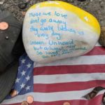 Items from a temporary memorial at the site of the Oso landslide. (Hanna Scott/KIRO Radio)