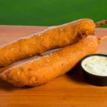 Jack's BBQ jalapeño-cheddar sausage dipped in buttermilk hush puppy batter and fried. (Ben VanHouten/Mariners)