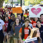 
              CORRECTS MONTH TO MARCH Hundreds of students from Miami Country Day, a private school in Miami Shores, Fla., take to the streets in the national students walkout protesting gun violence and honoring the 17 students and teachers that were killed last month at Marjory Stone Douglas High School on Wednesday, March. 14, 2018, in Parkland.  (C.M. Guerrero/Miami Herald via AP)
            