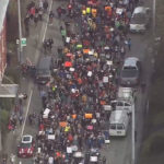 Dozens of Roosevelt High School students walked out of class on Wednesday and marched to UW campus to protest gun violence on campus. (KIRO 7 chopper)