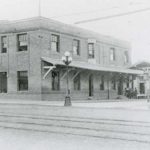 A 1914 view of the Interurban Building, when it was just two stories tall.  The covered platform on the right was for local streetcar and autobus passengers, and remnants of its foundation and post footings may still be visible in the parking lot now at the site. (Everett Public Library)