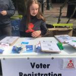 Big push to register kids eligible to vote in November here at the "We Won't Be Next Seattle" rally against gun violence at Occidental Park. (Hanna Scott/KIRO Radio)