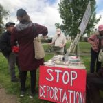 Demonstrators with the workers' rights march set up at Judkins Park in Seattle on May Day 2018. (Mike Lewis, KIRO Radio)