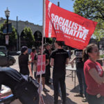 Folks gather in Seattle for a rally on  Saturday. (KIRO Radio/Hanna Scott)