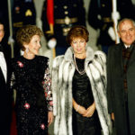 President Ronald Reagan and first lady Nancy Reagan greet Soviet leader Mikhail Gorbachev and his wife Raisa outside the White House before a State Dinner, Dec. 8, 1987.  Earlier in the day, Reagan and Gorbachev signed a treaty to eliminate intermediate-range missiles.  (AP Photo/Ron Edmonds)