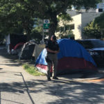 Seattle's Navigation Team clears out Tent Mansion on Tuesday. (KIRO 7/Rob Munoz)