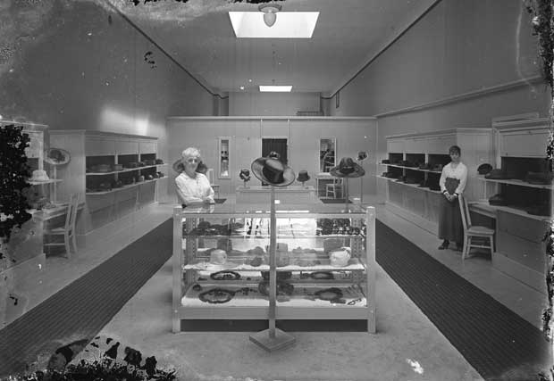 This photo of a women’s hat shop from a century ago, perhaps in Tacoma, reminds Michael Sullivan of the Edward Hopper painting “Nighthawks.” (Washington State Historical Society)