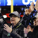 Paul Allen hoists the Lombardi Trophy after the Seahawks 2014 Super Bowl victory. (AP)