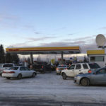 
              Cars line up for gas at an open station in Anchorage, Friday, Nov. 30, 2018. Back-to-back earthquakes measuring 7.0 and 5.8 rocked buildings and buckled roads Friday morning in Anchorage, prompting people to run from their offices or seek shelter under office desks, while a tsunami warning had some seeking higher ground. (AP Photo/Mark Thiessen)
            