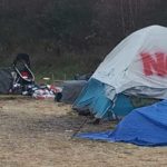 Seattle's Navigation Teams cleans up a homeless encampment in Northgate in January 2019. (Carolyn Ossorio, KIRO Radio)