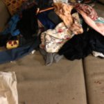 The squatter left drugs and cigarette marks on the sofa, destroying it, and threw garbage from outdoors all over Natalie's clothes. (Photo courtesy of Natalie)