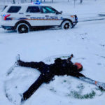 A Tacoma Police officer takes a quick break for a snow angel. (Tacoma PD)