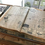 The display includes bound volumes of old Anacortes newspapers. (Feliks Banel)