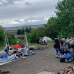 Residents of Dearborn's homeless camp on their way out on Monday. (Aaron Granillo, KIRO Radio)