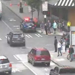 Police respond to the scene of a naked man stabbing people near 6th and Olive in downtown Seattle. (KIRO 7)