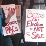 A protest in front of the Amazon Spheres after the tech company donated $1.5 million to a PAC aimed at Seattle elections. (Hanna Scott, KIRO Radio)