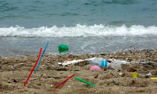 Plastic on a beach near the ocean...