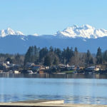 Cascade peaks are visible from the dock at Wyatt Park on Lake Stevens. (Feliks Banel for KIRO Radio)